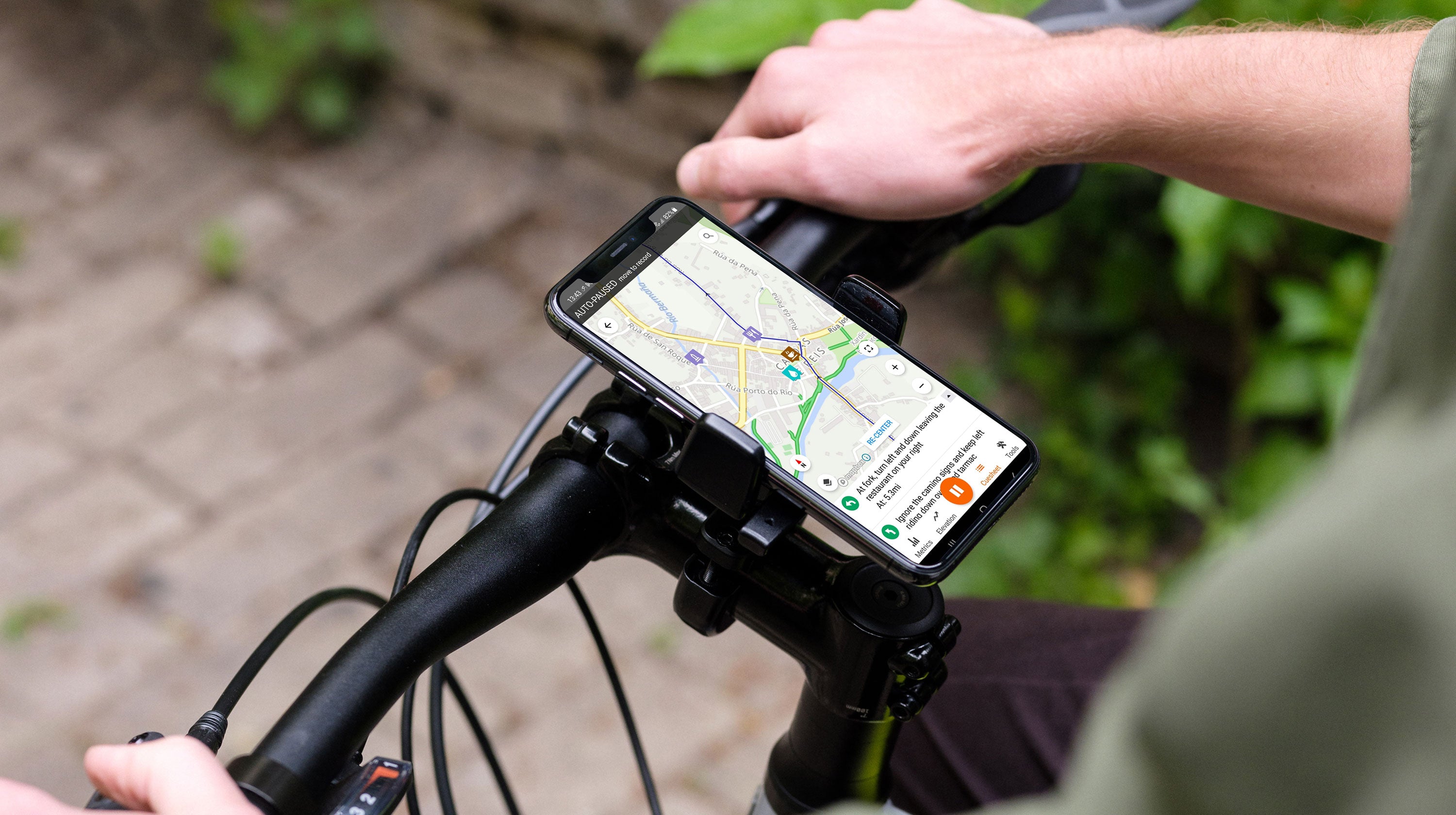Smartphone with Routzz built app on handlebar of a bicycle